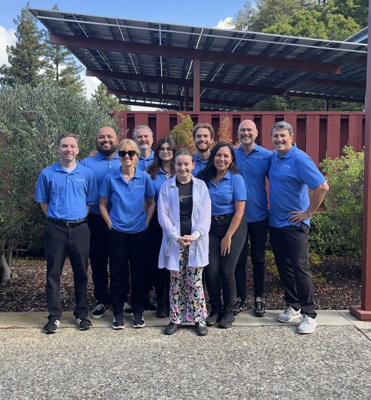 The Cionic team, in matching blue shirts, standing together outside